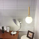 Modern glass pendant light with adjustable gold metal bulb