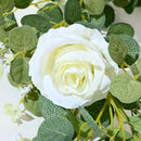 Artificial pink flowers and green plants for indoor decoration
