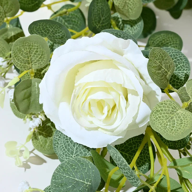 Artificial pink flowers and green plants for indoor decoration