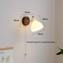 Modern glass and brass wall light with switch