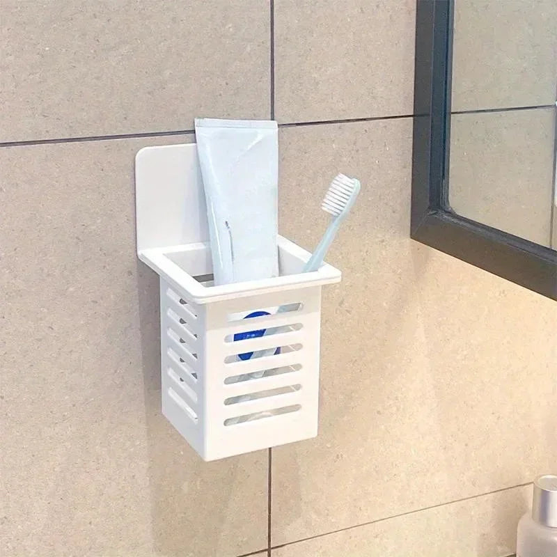 Self-adhesive wall-mounted toothpaste and toothbrush holder