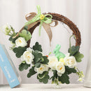 Decorative Easter wreath with bunny and hanging eggs