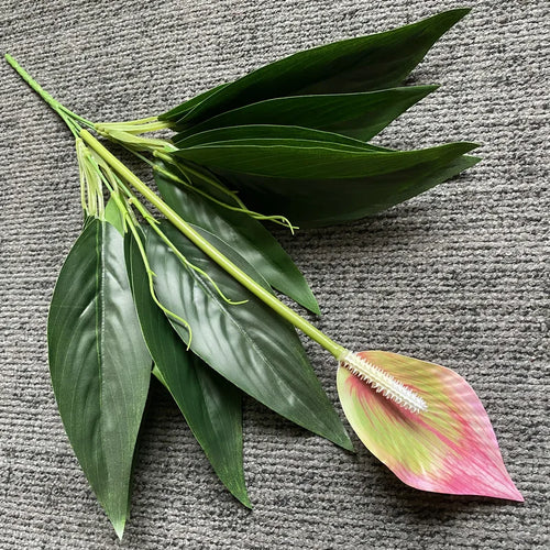 Tropical artificial monstera and anthurium plants for indoor decoration