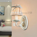 Iron wall light with fabric lampshade and ribbon bow