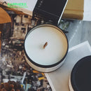 scented candles in tin cans with dried flowers