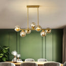 Suspended copper chandelier with glass globe for interior decoration