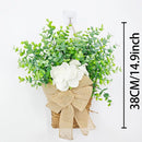 couronne de printemps en eucalyptus et fleurs blanches décorative