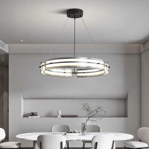 Minimalist iron pendant light with rippled glass for modern interiors