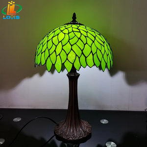 Tiffany style table lamp with decorative green leaves