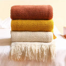 Nordic knitted throw with pompoms for sofa or bed