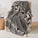 Soft boho knitted throw with tassels and geometric pattern