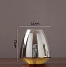modern glass vase with metal base for floral decoration