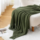 Chenille knit throw with pompoms and checked pattern decor