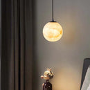 Nordic marble pendant light with elegant suspended globe