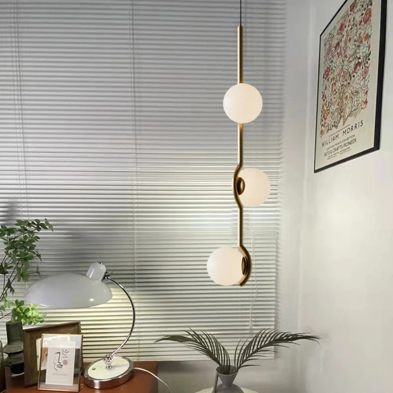 Simple glass and metal pendant light with adjustable wire
