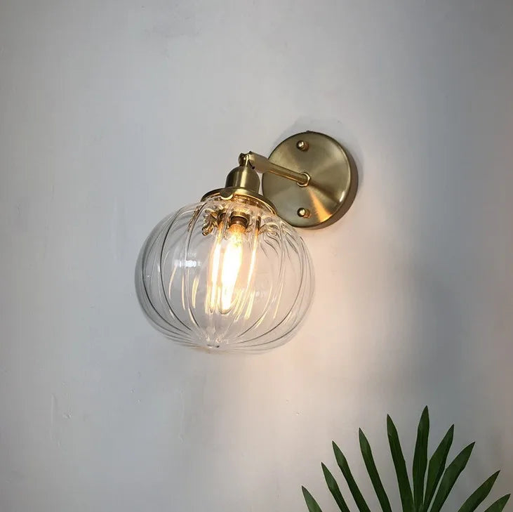 Retro brass and glass wall light with elegant design for interiors