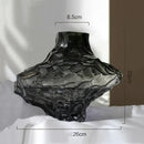 glass vase with decorative stones for flowers and terrarium