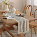 Beige boho table runner with geometric patterns and tassels