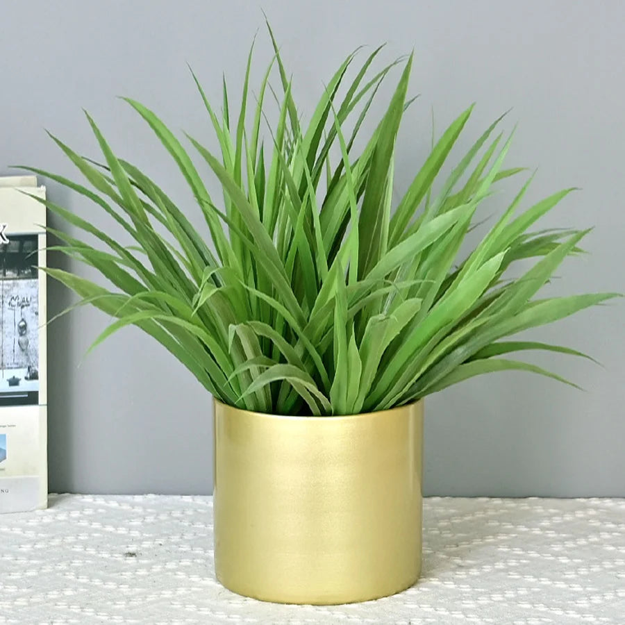 Artificial tropical palm and decorative orchid plant bouquet