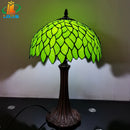 Tiffany style table lamp with decorative green leaves