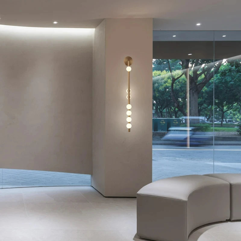 Modern glass and metal wall light for an elegant interior