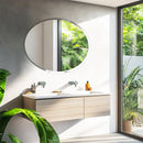 Decorative oval frameless mirror for elegant interiors