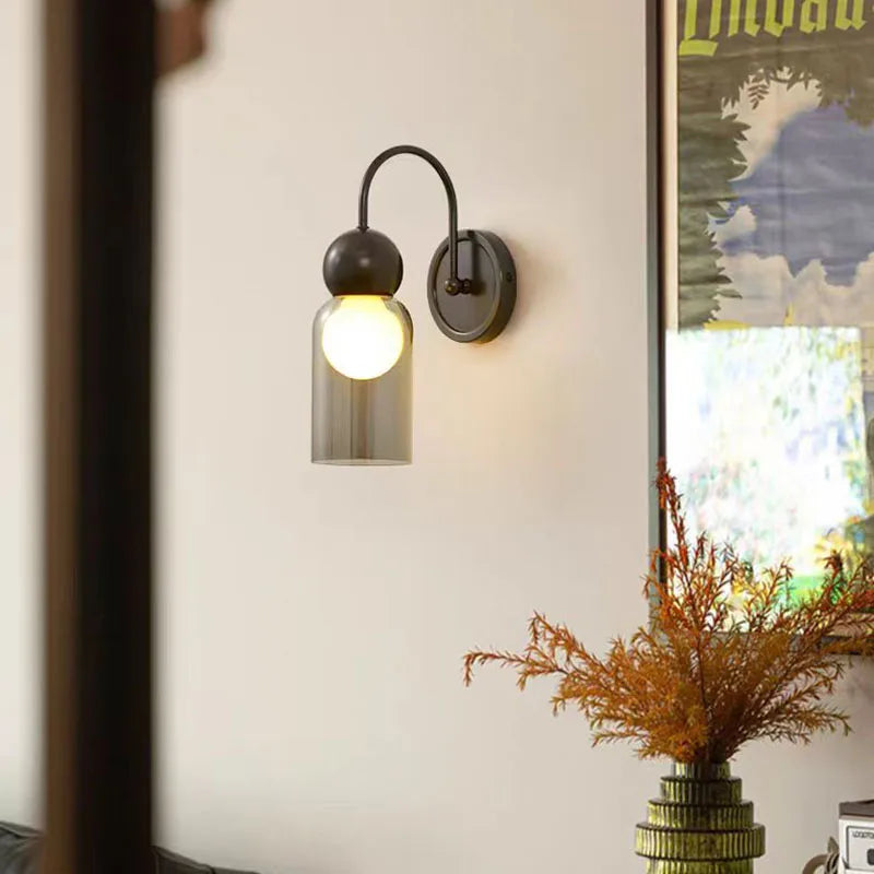 Modern glass and brass wall light for elegant interiors