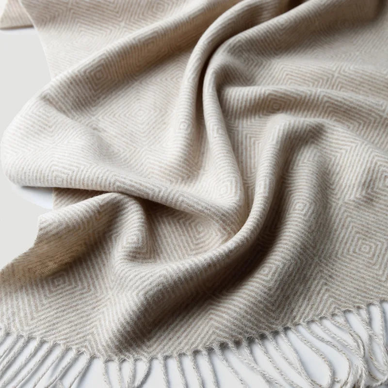 Soft wool throw with spiral pattern and fringes