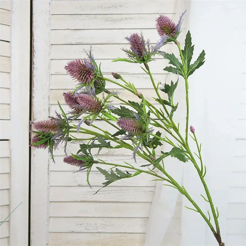 Decorative artificial sea holly flowers in pink and violet