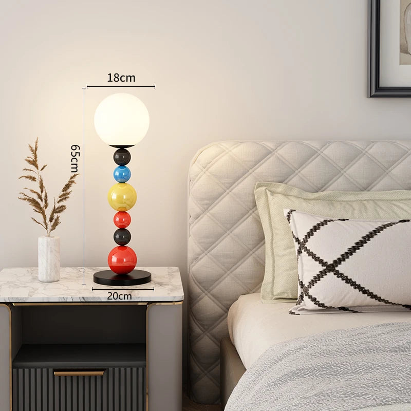 Modern floor lamp with colourful beads and glass shade