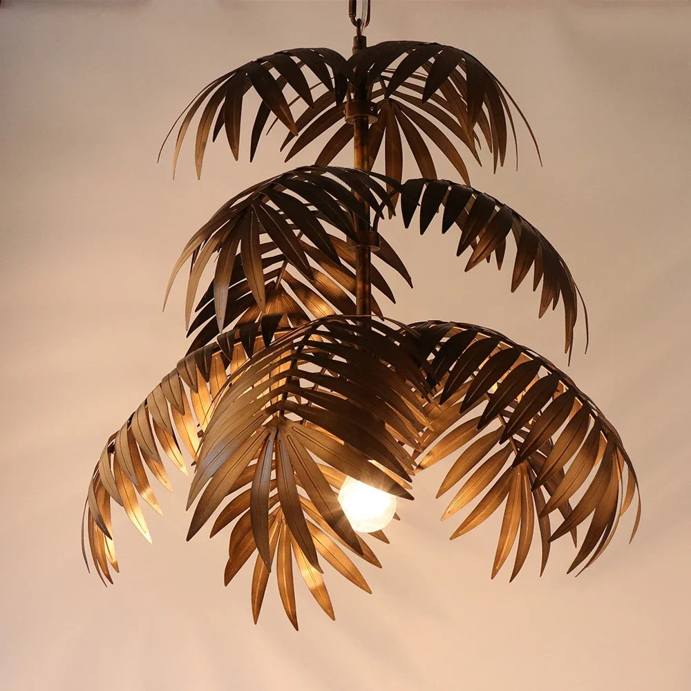 Vintage industrial chandelier with coconut leaves, tropical bohemian style