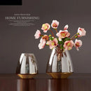 modern glass vase with metal base for floral decoration