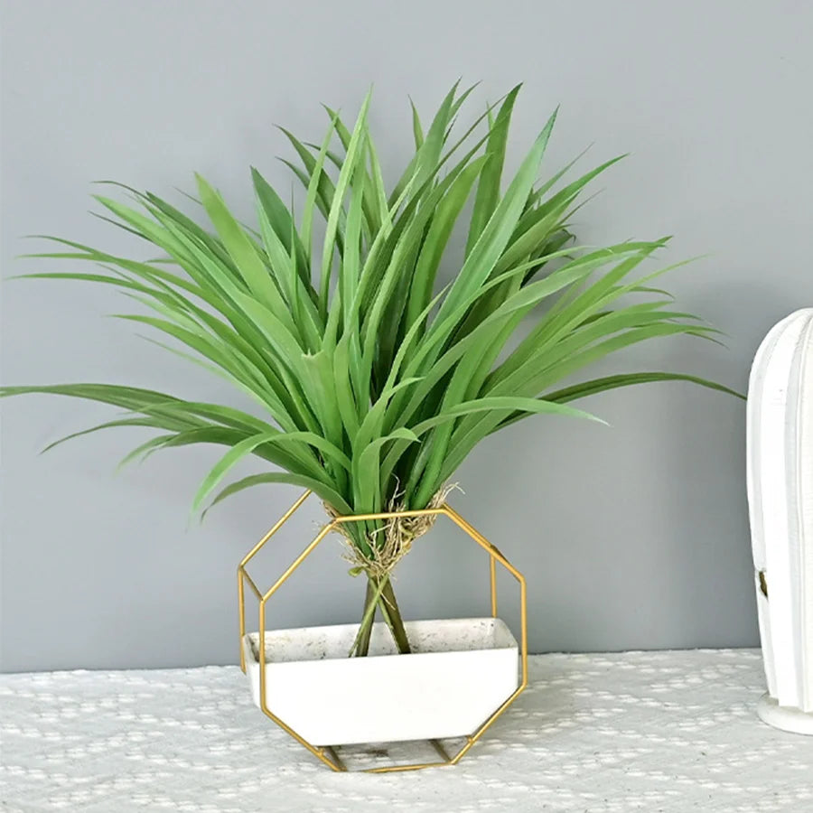 Artificial tropical palm and decorative orchid plant bouquet