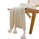 Chunky waffle knit throw with pom poms nordic style