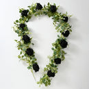 Artificial pink flowers and green plants for indoor decoration