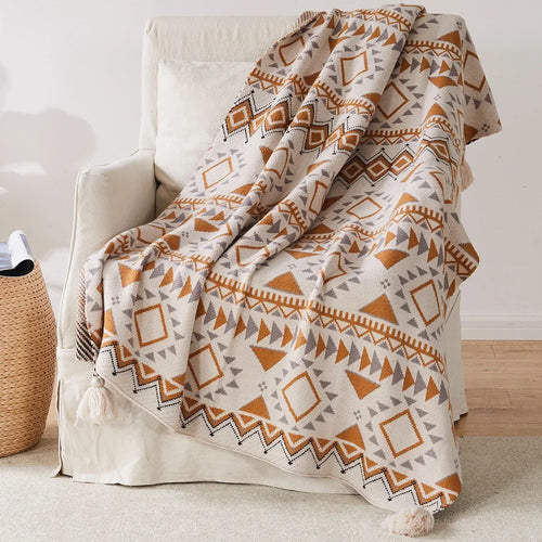 Knitted boho-style geometric throw with pompoms - vue 4 sur 6