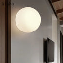 Minimalist glass LED wall light for indoor use