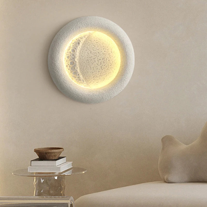 Round moon LED wall light with interchangeable art deco design