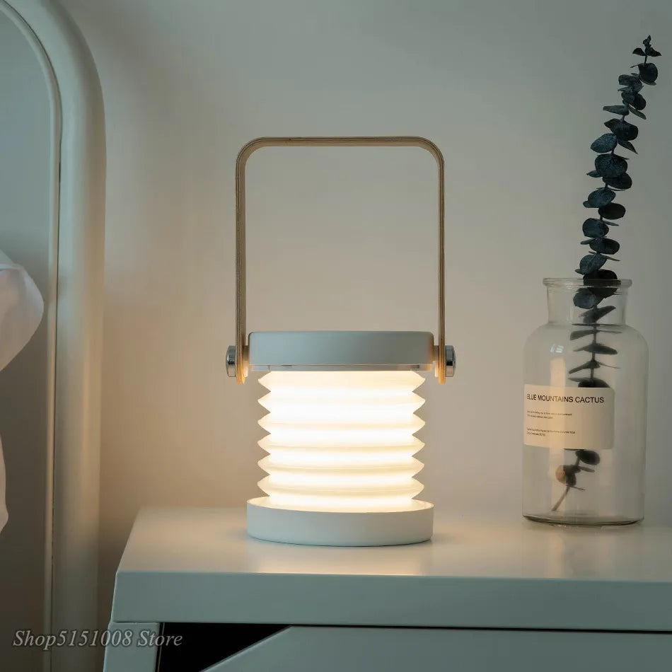 Creative foldable LED table lamp with wooden handle, portable lantern and USB charging - vue 4 sur 9