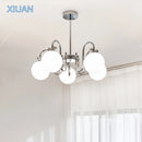 Modern chrome chandelier with glass pendant