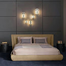 Elliptical glass and gold metal wall light