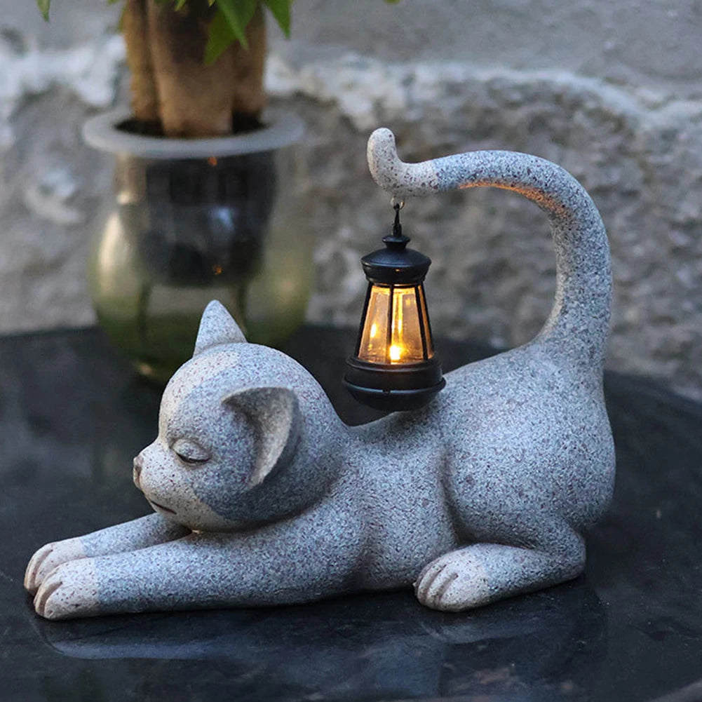 Garden cat statue with decorative solar lantern for outdoor use