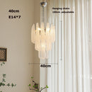 Coloured glass pendant with decorative leaf for chic interiors