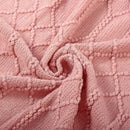 Lightweight acrylic knitted throw with pom poms, cosy style