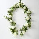 Artificial pink flowers and green plants for indoor decoration
