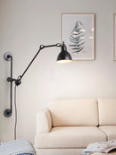 Industrial wall light with adjustable arm for modern interiors