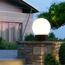 Outdoor black globe post lamp for garden and terrace lighting
