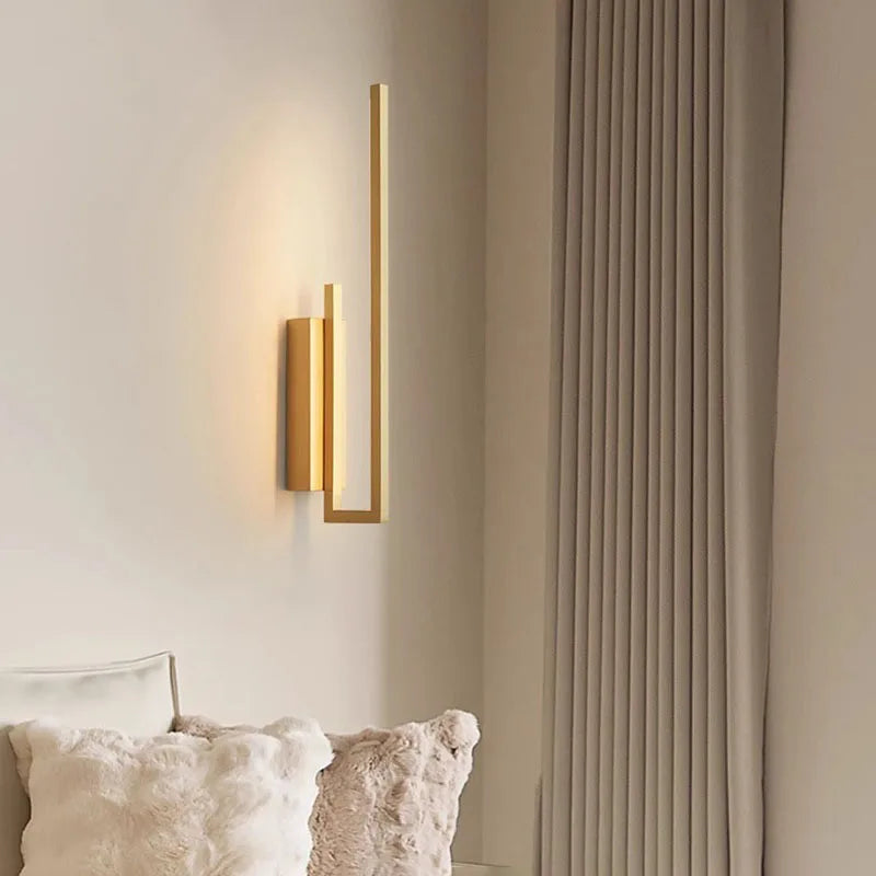 Modern brass wall light for multiple spaces