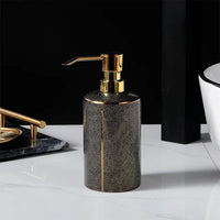 Ceramic soap dispenser and gold bathroom accessories set