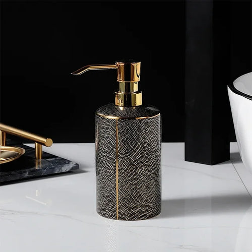 Ceramic soap dispenser and gold bathroom accessories set